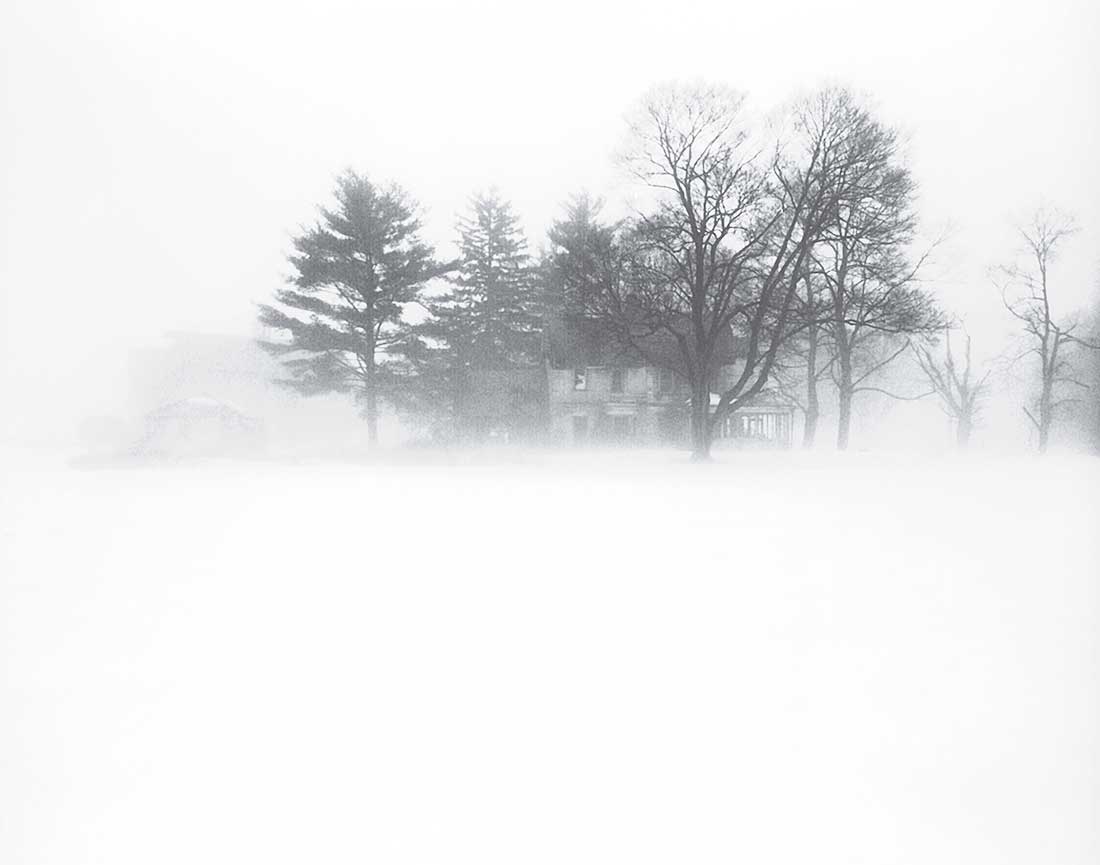 Winter storm and old house