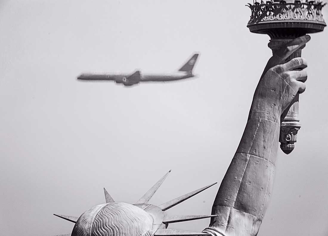 State of Liberty and commercial jet.