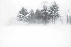 Winter storm and old house