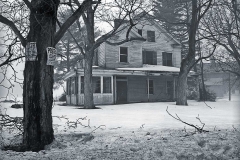 Winter storm and old house