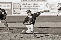 Baseball pitcher pitching baseball.