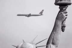 State of Liberty and commercial jet.
