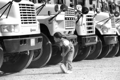 Young boy looking at School Bus