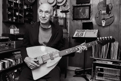 Elderly man playing guitar