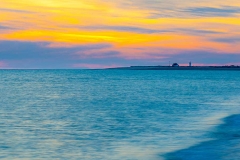 Sunset over lighthouse, Herring Cover Beach, Provincetown, Cape Cod.