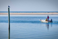Two people in boat in Cape Cod Bay.