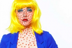 A young lady dressed like a Roy Lichtenstein painting at the Comic Con Convention.