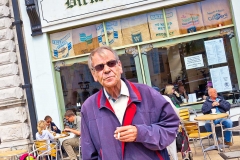 Man standing outside Dickens Corner in Dover, England.