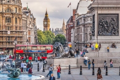 Trafalgar Square, people and a bus.