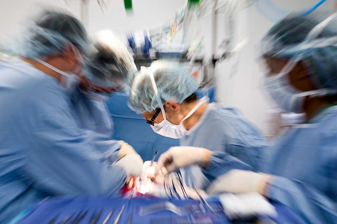 Doctors and Nurses in the Operating Room in a hospital.