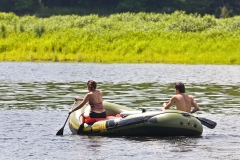 Boaters on a river.