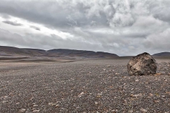 A boulder on a lifeless plain in northern Iceland