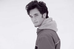 Young Man Standing in Snow