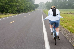 A Bike Rider on the road.