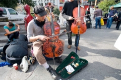 Street musicians playing music in New York City.